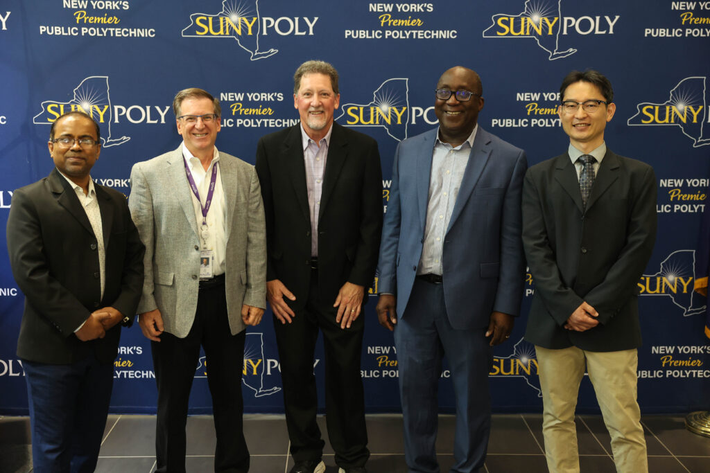 Dr. Mohammed Jasim Uddin, Dr. Bongmook Lee and other Poly staff photographed together.