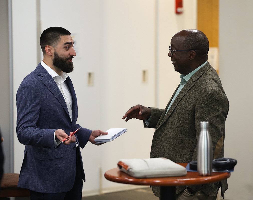 Two professionals engaging in conversation.