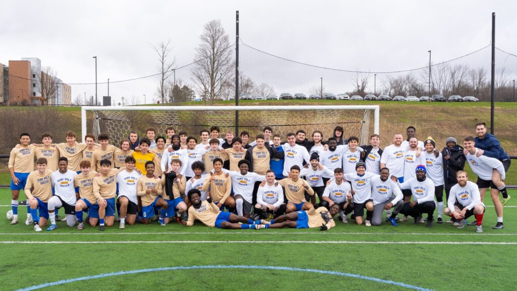 Alumni and current men's soccer players photographed all together. 