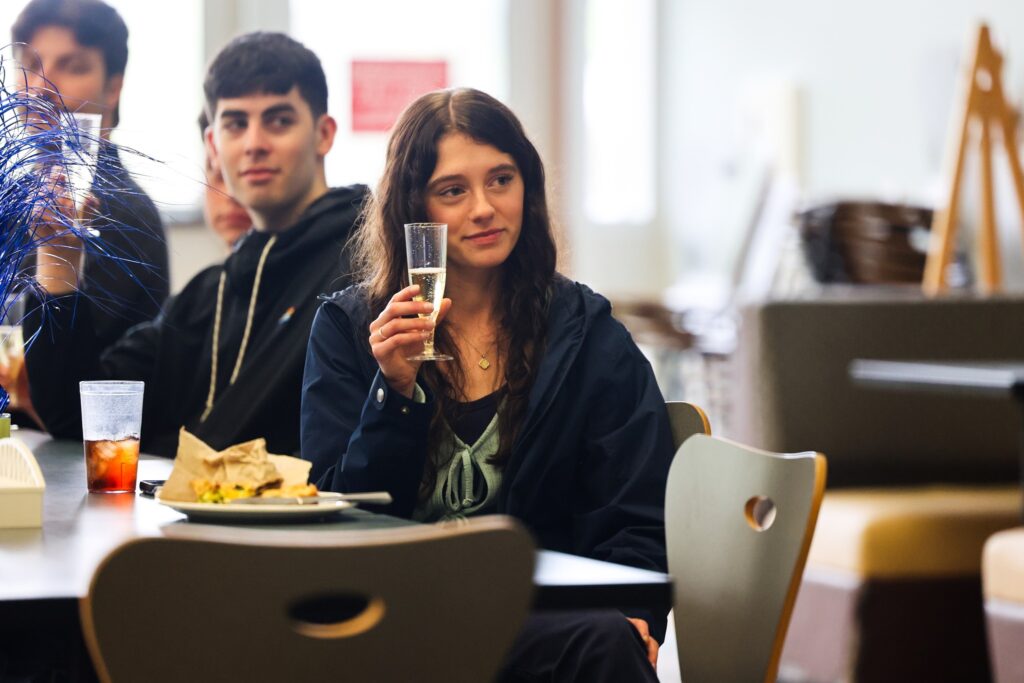 Students raising a toast at a class gathering.