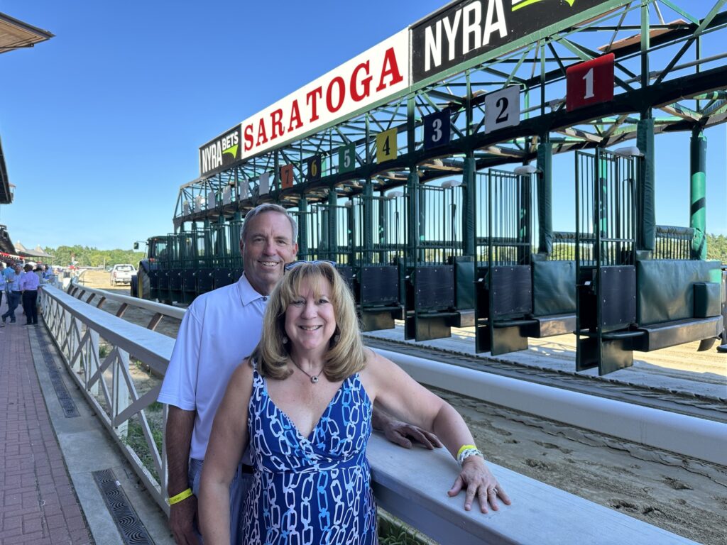 Group of Alumni photographed at the Saratoga Race Track.