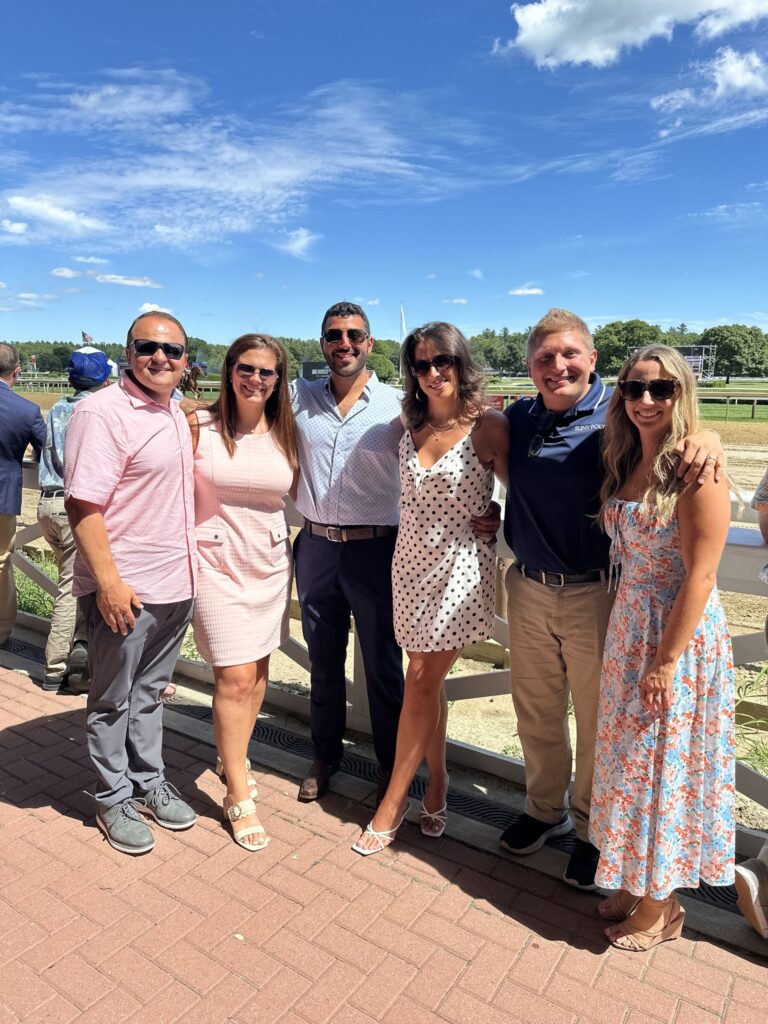 Group of Alumni photographed at the Saratoga Race Track.