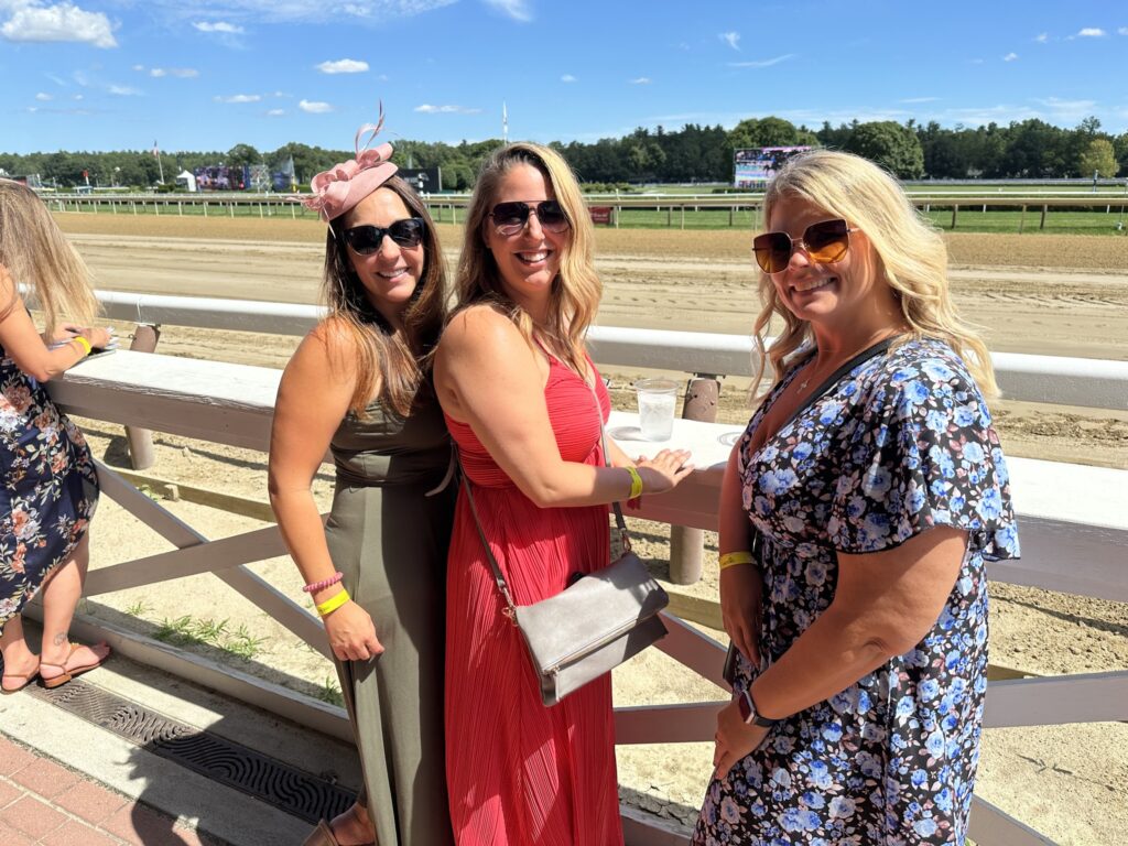 Group of Alumni photographed at the Saratoga Race Track.