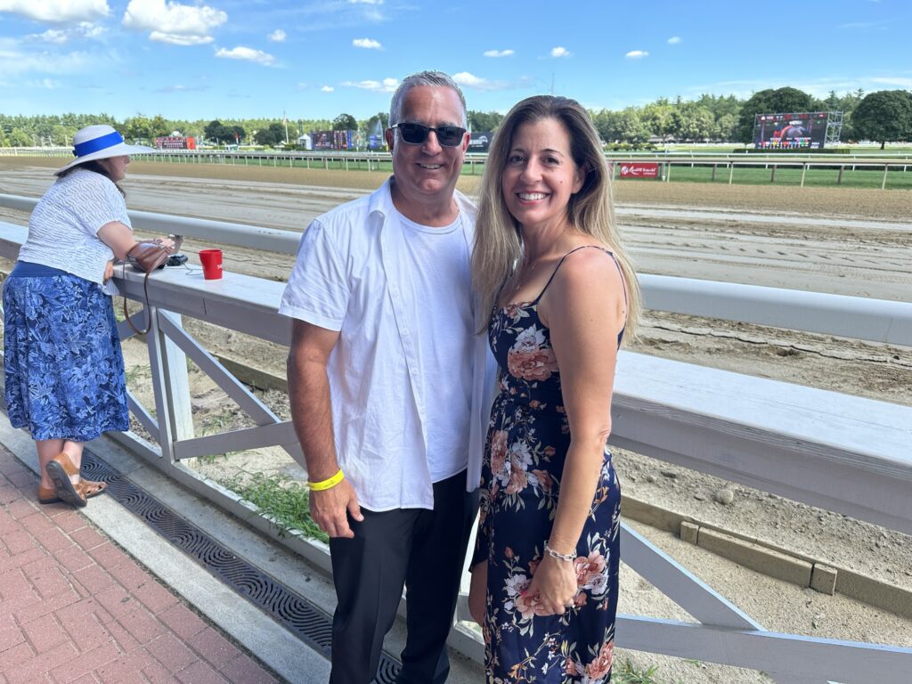 Group of Alumni photographed at the Saratoga Race Track.