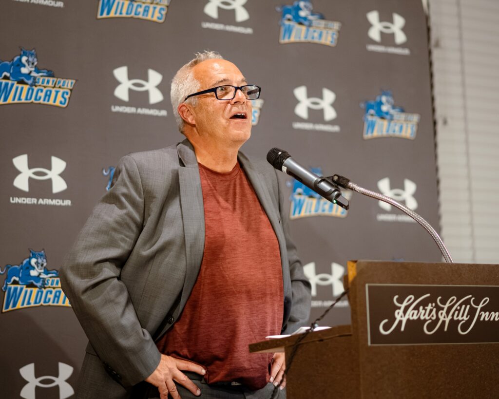 Man gives speech at Homecoming Weekend.