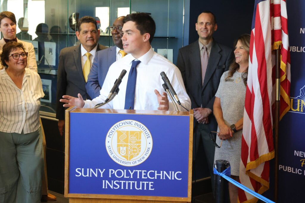 Student giving a speech at the opening of the NYSTEC Center.