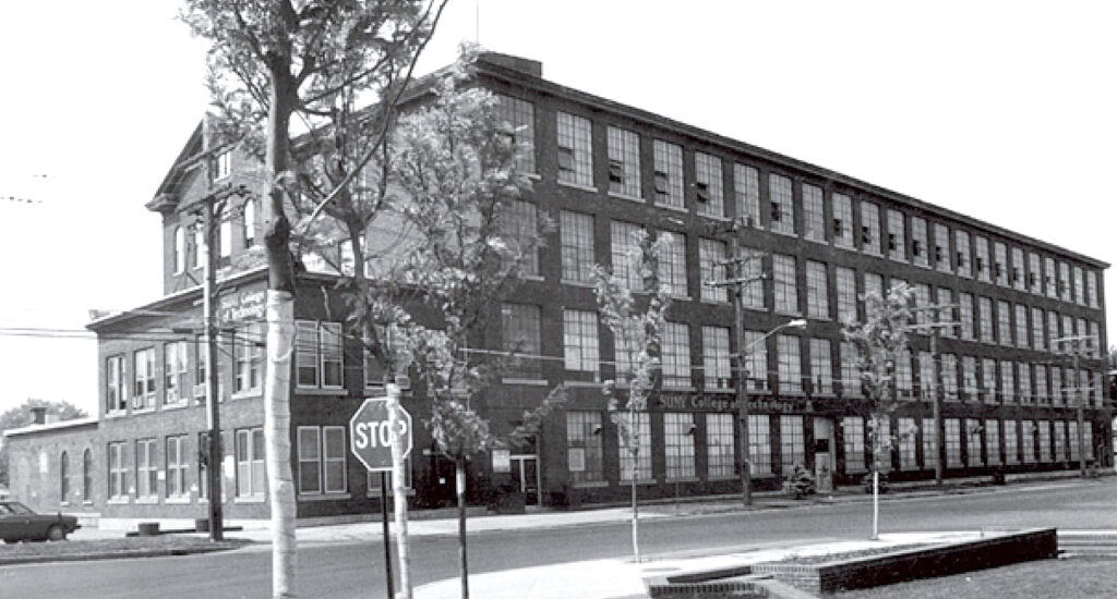 Black and white image of the old SUNY College of Technology campus building.