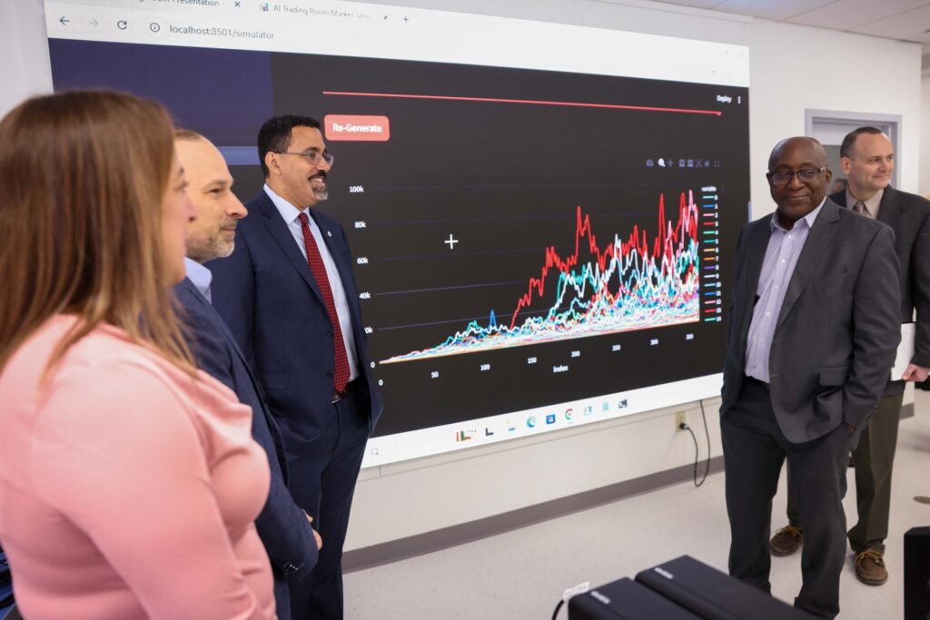 Chancellor John B. King Jr and President Soboyejo present data to a group.