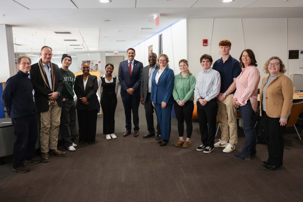 Chancellor John B. King Jr, President Soboyejo and other students and staff photographed in the Student Center.