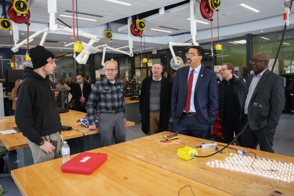 Chancellor John B. King Jr, President Soboyejo and other staff in the CGAM Labs.