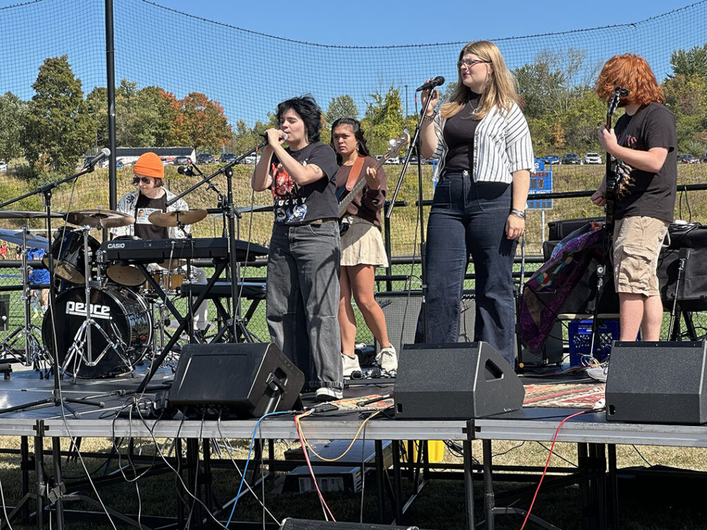 Band playing on stage at Homecoming Weekend.