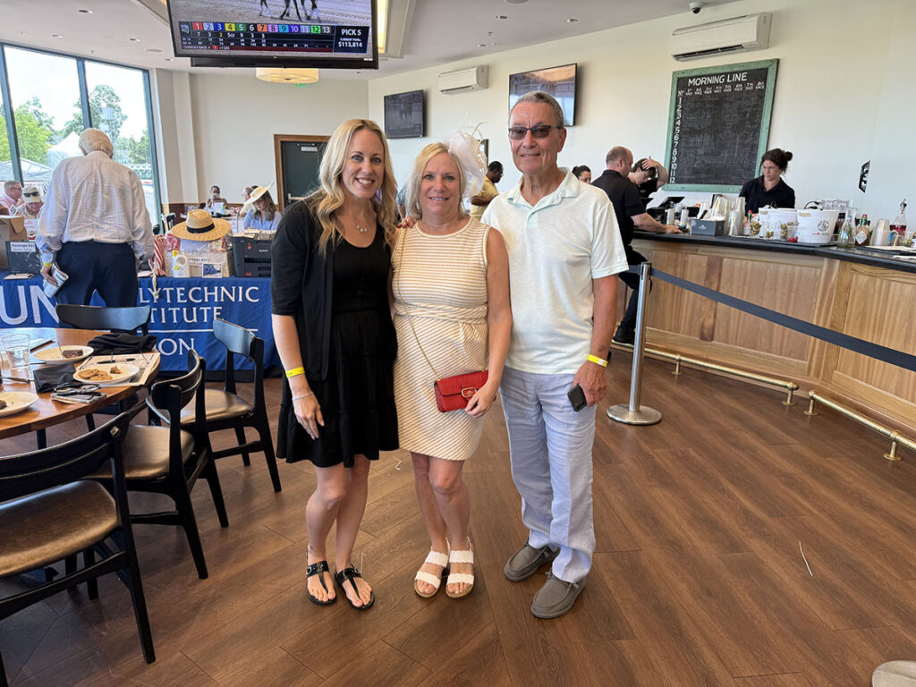 Group of Alumni photographed at the Saratoga Race Track.