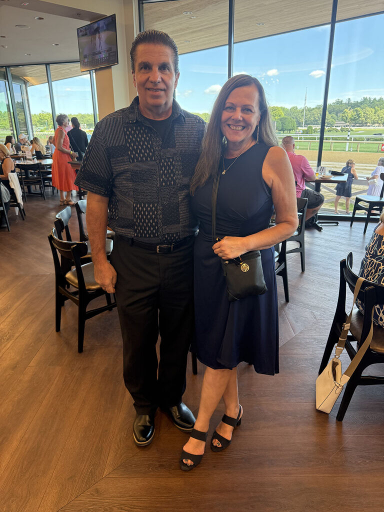 Group of Alumni photographed at the Saratoga Race Track.