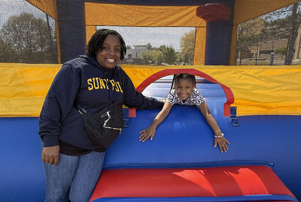 Mom and daughter in the bounce house.