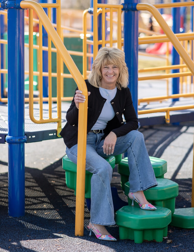 Lorene Bass photographed on playground steps.