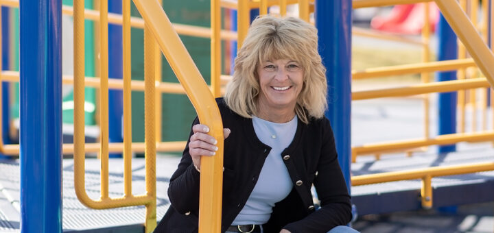 Lorene Bass photographed on playground steps.