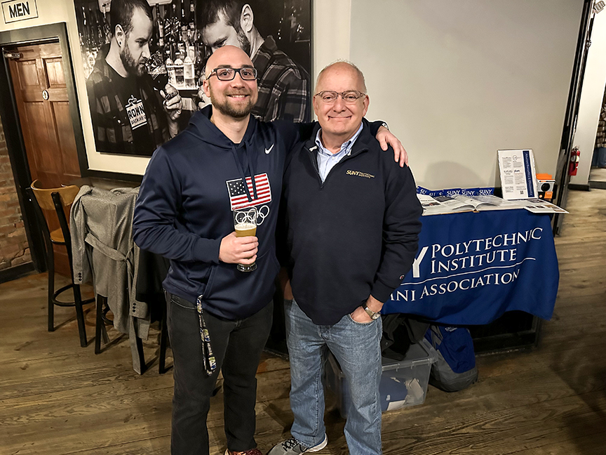 Alumni photographed together in the Brown's Brewing Company.