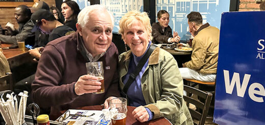 Two alumni photographed in Brown's Brewing Company.